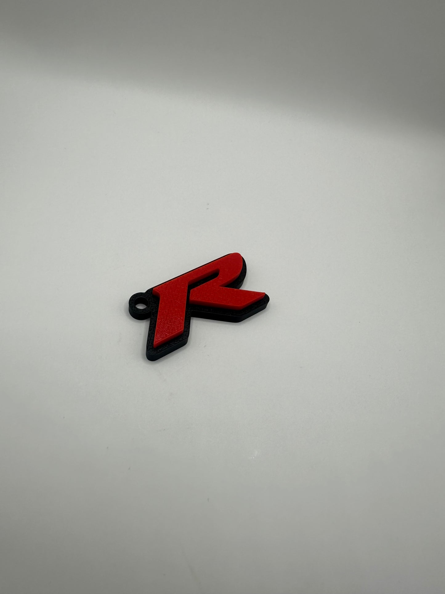 Llavero con la letra “R” de Type R