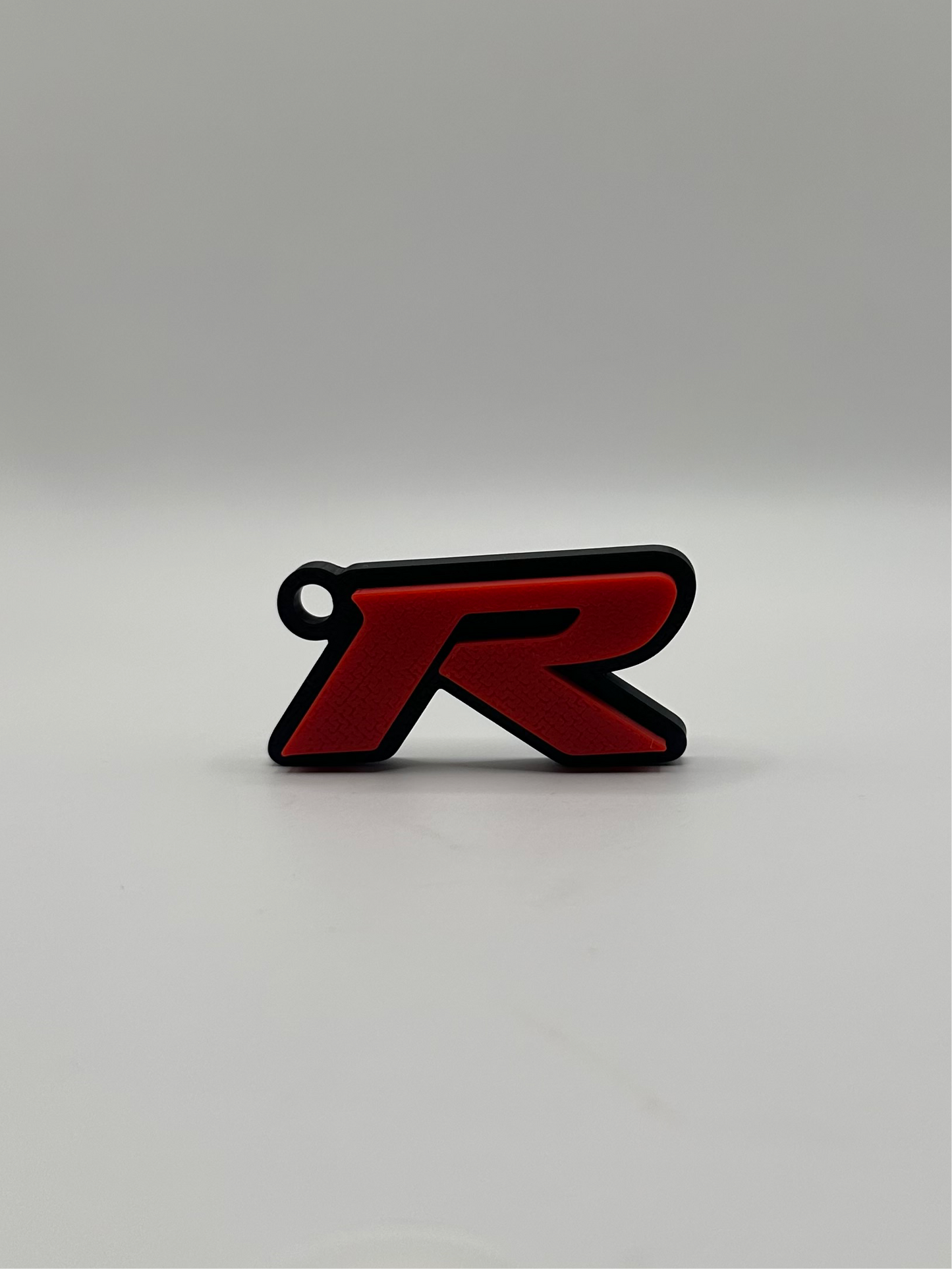 Llavero con la letra “R” de Type R