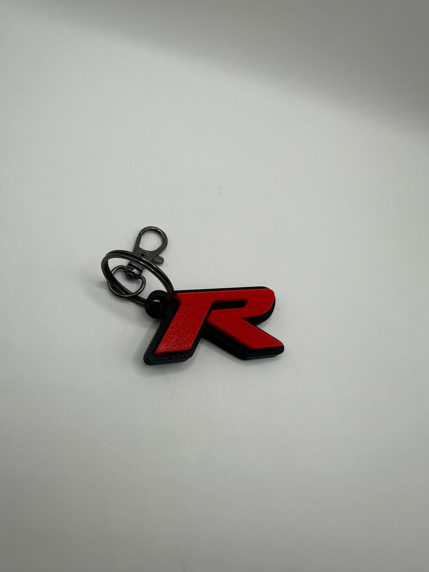 Llavero con la letra “R” de Type R