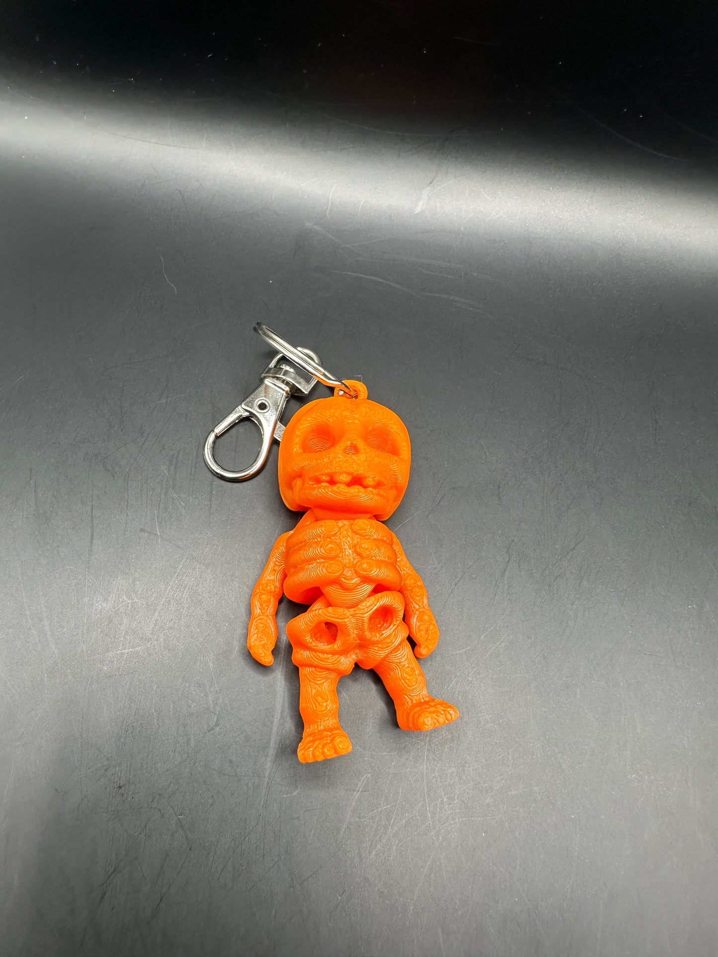 Llavero articulado con esqueleto de calabaza