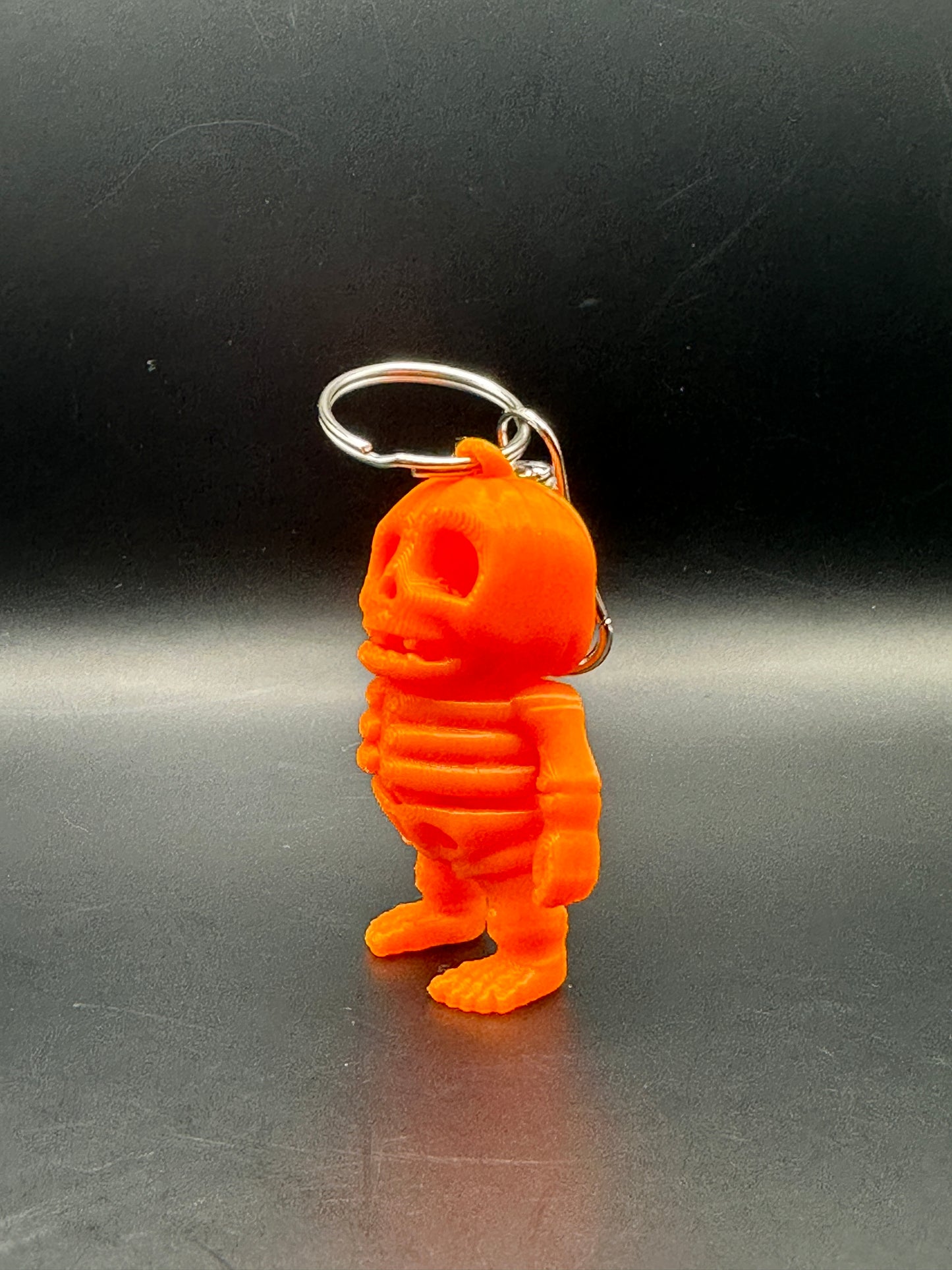 Llavero articulado con esqueleto de calabaza